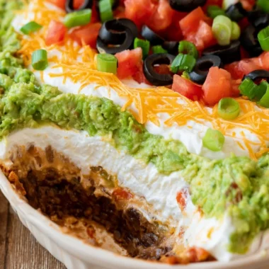 Delicious 7 Layer Dip with vibrant ingredients layered in a dish