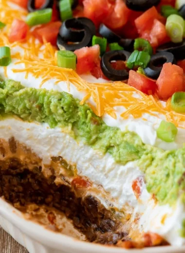 Delicious 7 Layer Dip with vibrant ingredients layered in a dish
