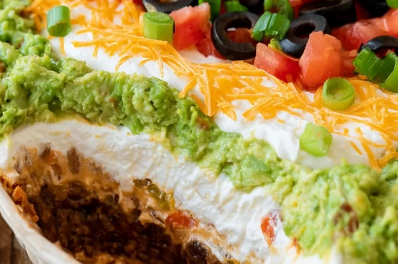 Delicious 7 Layer Dip with vibrant ingredients layered in a dish