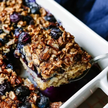 Baked oatmeal with fresh blueberries in a serving dish