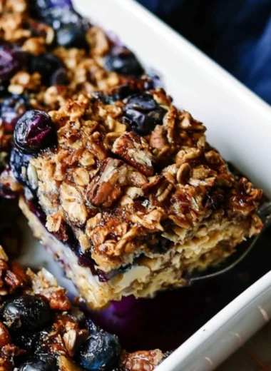 Baked oatmeal with fresh blueberries in a serving dish