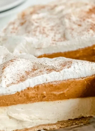 No-bake pumpkin pie topped with whipped cream and cinnamon
