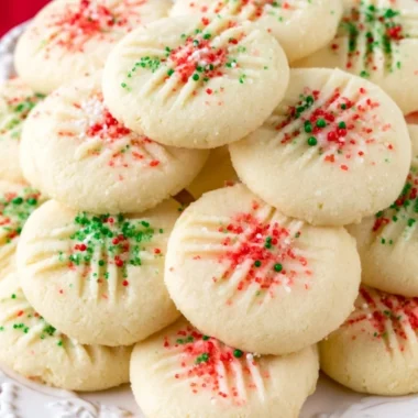 Cozy whipped shortbread cookies decorated with festive sprinkles