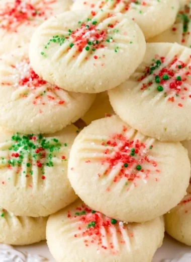 Cozy whipped shortbread cookies decorated with festive sprinkles