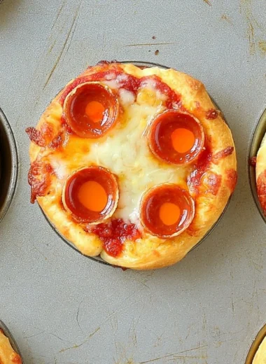Delicious deep dish mini pizzas served on a rustic wooden table.