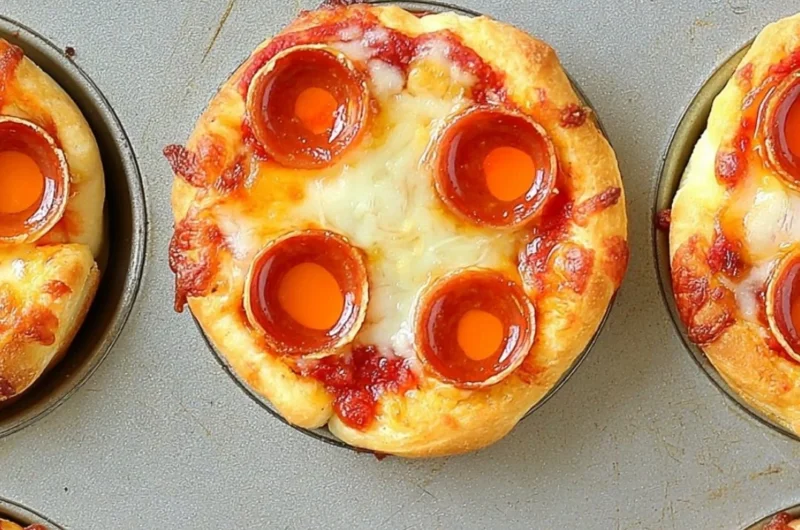 Delicious deep dish mini pizzas served on a rustic wooden table.
