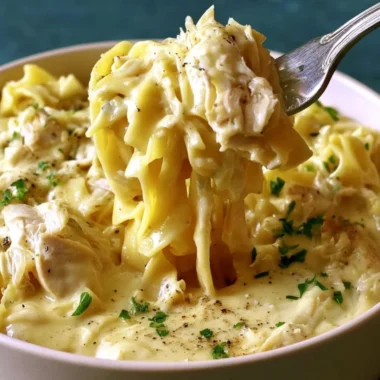 Bowl of easy creamy chicken and noodles with herbs and spices