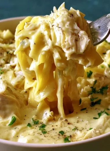 Bowl of easy creamy chicken and noodles with herbs and spices