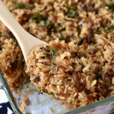 Delicious French Onion Ground Beef and Rice Casserole garnished with herbs