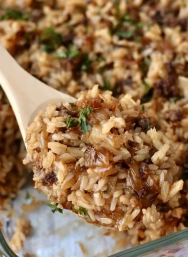 Delicious French Onion Ground Beef and Rice Casserole garnished with herbs