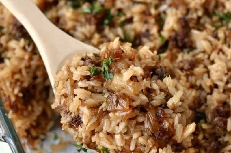 Delicious French Onion Ground Beef and Rice Casserole garnished with herbs
