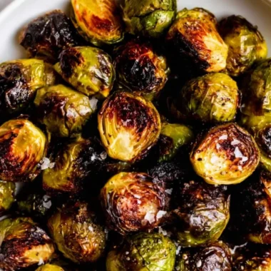 Plate of delicious roasted Brussels sprouts with a golden-brown crisp