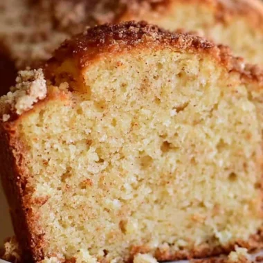 Delicious spiced Eggnog Loaf served with festive decorations